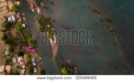 Birds Eye View Of The 4000 Islands With A Boat Driving On The Mekong River Delta In Laos.
