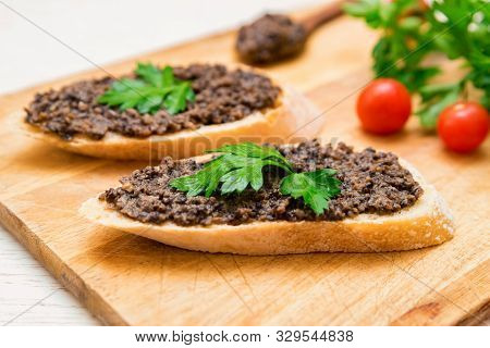 Fresh Tasty Bruschetta With Truffle Sauce, Parsley And Tomates