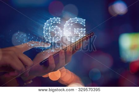Concept Of Future Technology 6g Network, Hands Press Smartphone And High-speed New Generation Networ