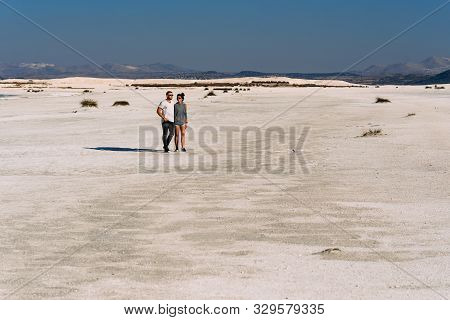A Loving Couple Walks Along The Coast Of Lake Salda In Turkey. Couple Travels In Turkey. Lake Salda 