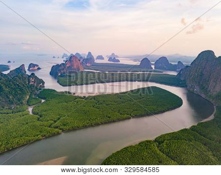 Aerial Top View Of Samet Nangshe And Tropical Green Forest Trees At Sunset With Andaman Sea In Phang