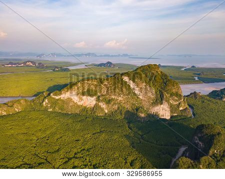 Aerial Top View Of Samet Nangshe And Tropical Green Forest Trees At Sunset With Andaman Sea In Phang