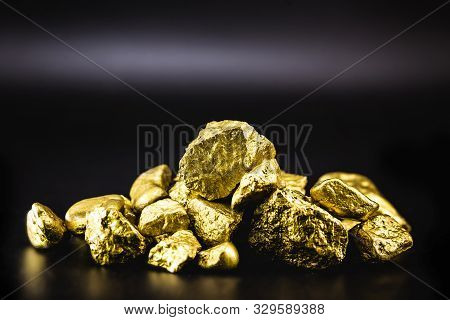 Golden Nuggets Isolated On Black Background. Luxury Concept.