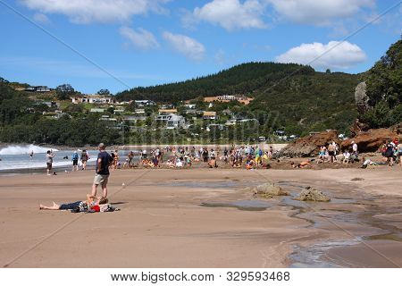 Coromandel, New Zealand - March 11, 2008: Tourists Dig Their Own Hot Springs In Hot Water Beach, Cor