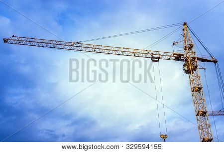 Yellow Tower Cranes At Construction Site. Construction Crane Working At Building Site