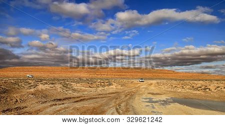Road At Sunset Crossing The Karakum Desert In Turkmenistan.