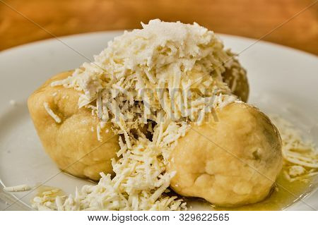 Tasty Homemade Curd (cream Cheese) Dumpling Stuffed With Plums With Hard Curd, Sugar And Melted Butt