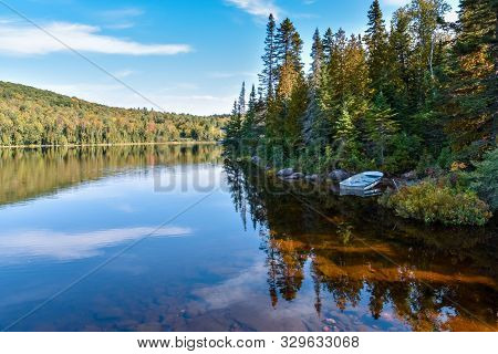Autumn Forest Landscape And Reflection In The Lake. La Mauricie National Park, Canada.