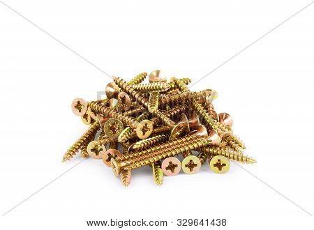 A Pile Of Long Wood Screws On A White Background