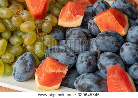 Fruit Platter - Grapes, Plum, Red Grapefruit. Assorted Fruit