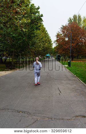 Girl Running On An Alley In Izvor Park, Bucharest, Romania, 2019