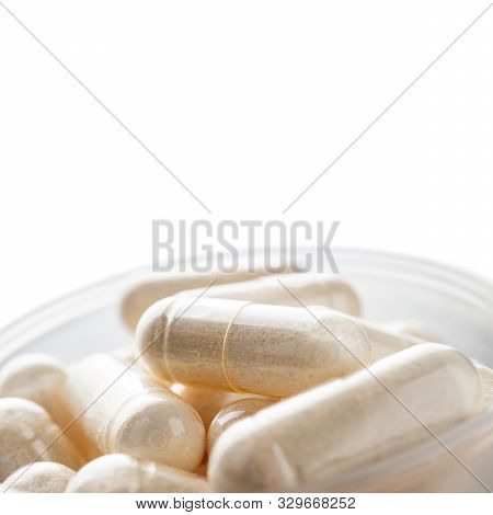 White Medical Capsules Of Glucosamine Chondroitin, Healthy Supplement Pills In The Plastic Spoon Iso