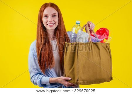 Beautiful Redhaired Ginder Happy Woman Holding Cotton Eco Bag With Sorting Recycle Trash:plastic Bot