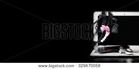 Adult Webcam And Virtual Sex Chat Concept. Laptop With Female Panties, Dildo Vibrator And Buttplug O