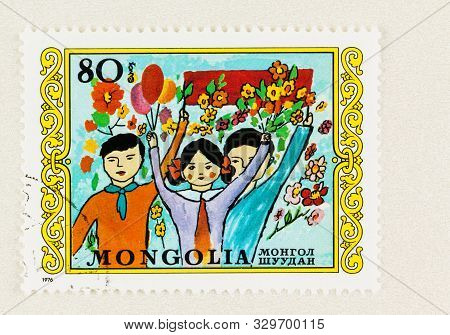 Seattle Washington - October 4, 2019: Children And Flowers  On Commemorative Mongol Postage Stamp Is