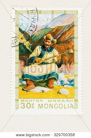 Seattle Washington - October 4, 2019:  Painting Of Mongol Man In Traditional Dress, Resting Outside 
