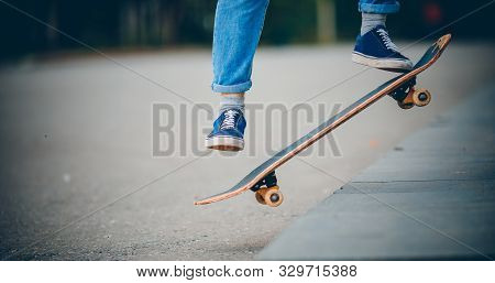 Skateboard Man In Shoes And Jeans Getting Ready To Jump Kickflip Olli From Steps