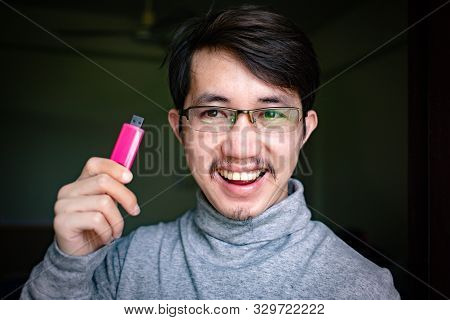 Portrait Of Asian Man Setting His Hair