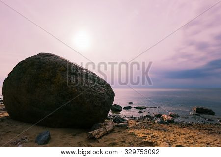 The Stone Laucu Akmens At  The Rigas Bay Beach In Latvia During Sunset In The Summer