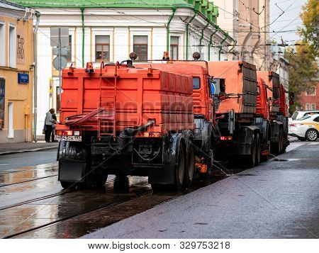 Moscow, Russia - October 19, 2019: Irrigation Sweepers Trucks Stand On The Tram Tracks In Front Of T