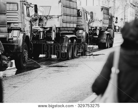 Moscow, Russia - October 19, 2019: Irrigation Sweepers Trucks Stand On The Tram Tracks In Front Of T