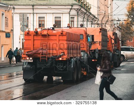 Moscow, Russia - October 19, 2019: Irrigation Sweepers Trucks Stand On The Tram Tracks In Front Of T