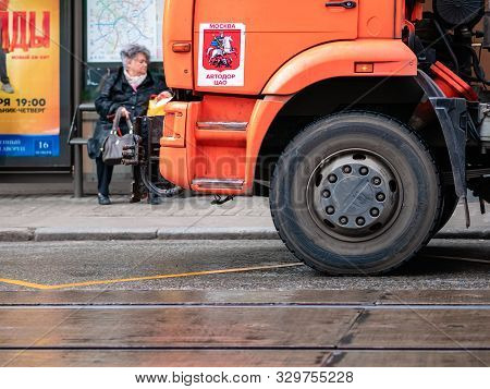 Moscow, Russia - October 19, 2019: Orange Irrigation Sweepers Truck Stand On The Tram Tracks. Moscow