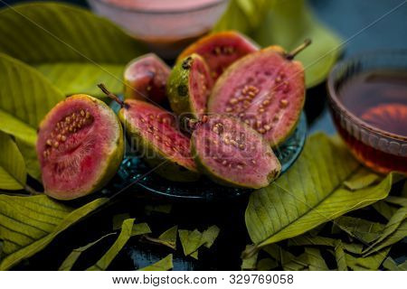 Skin Whitening Remedy/treatment On The Black Shiny Surface Consisting Of Guava Pulp And Honey. Also 
