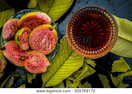 Skin Whitening Remedy/treatment On The Black Shiny Surface Consisting Of Guava Pulp And Honey. Also 