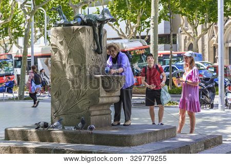 Barcelona, Spain - May 12, 2017: These Are Unidentified People At The Art Nouveau Drinking Fountain 