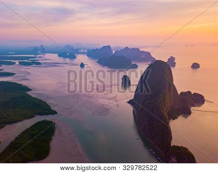 Aerial Top View Of Samet Nangshe, Mountain Valley Hills, And Tropical Green Forest Trees At Sunset W