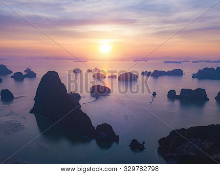 Aerial Top View Of Samet Nangshe, Mountain Valley Hills, And Tropical Green Forest Trees At Sunset W