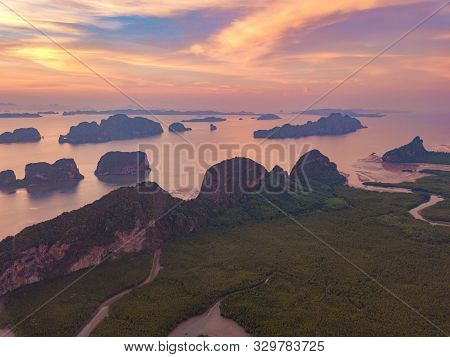 Aerial Top View Of Samet Nangshe, Mountain Valley Hills, And Tropical Green Forest Trees At Sunset W