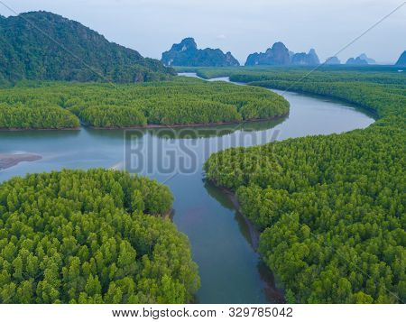 Aerial Top View Of Samet Nangshe, Mountain Valley Hills, And Tropical Green Forest Trees At Sunset W