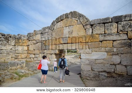 Hierapolis, Turkey - May 22, 2019: The Walls Of The Ancient Ruins Of Limestone Blocks. Ruins Of The 