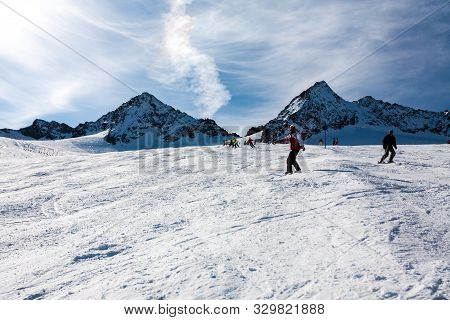 Stubai, Austria - November 1, 2011: Snowboarders And Skiers Riding On The Slopes Of The Stubaier Gle