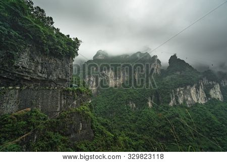 Bus With Tourists Driving Up The Winding Road Of 99 Turns To The Top Of The Tianmen Mountain, Zhangj