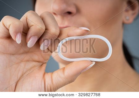 Woman Holding Vaginal Ring For Contraceptive Use