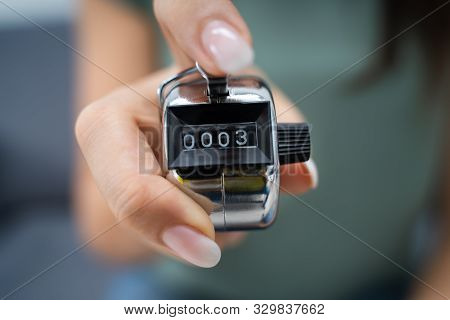Close-up Photo Of Young Woman Using Headcounter