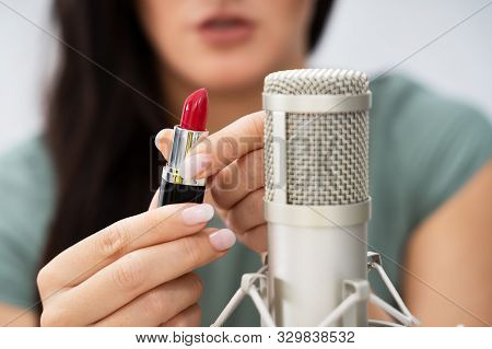 Woman Using Lipstick On Microphone To Make Asmr Sounds