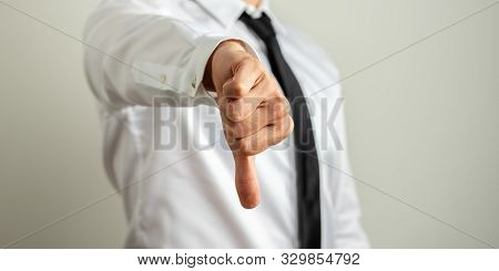 Businessman Showing Thumb Down Sign