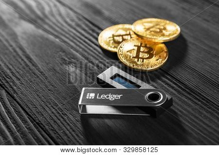 UKRAINE, ROVNO - On 25 October: Ledger hardware wallet for cryptocurrency on a black background