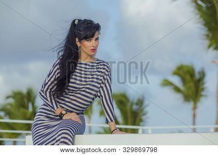 Sexy Latina With Long Black Hair At The Top Terrase Overlooking The Palm Trees