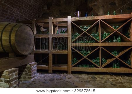 Mir, Belarus -  23-october-2019:  Wine Barrel And Bottles In Wine Cellar In Mir Castle. Mir, Grodno 