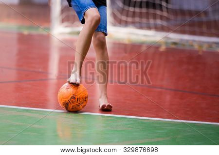 Futsal Players Barefoot. Futsal Player  Control And Shoot Ball To Goal.