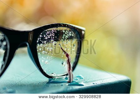 Vision Concept. Miniature Cleaner Wipe Out Many Droplet On Eyeglasses To Clear