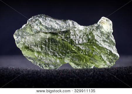Macro Photography Of A Moldavite Stone On A Black Background