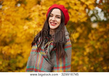 Young Beautiful Woman Smiling Female, Wearing Fashionable Red Beret And Wrapped Checkered Blanket Po