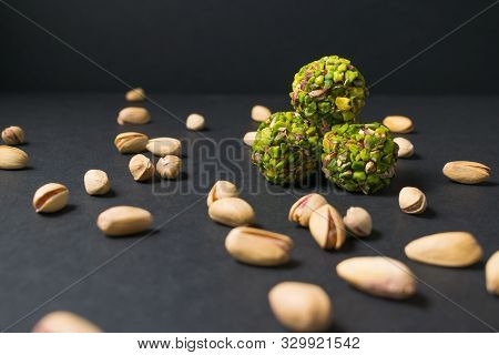 Candy Ball. Middle East Pistachio Confectionery. Healthy No Sugar Food. Scattered Pistachios. Closeu