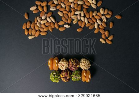 Middle East Pistachio Confectionery. Healthy No Sugar Food. Scattered Pistachio And Almond Nuts. Top